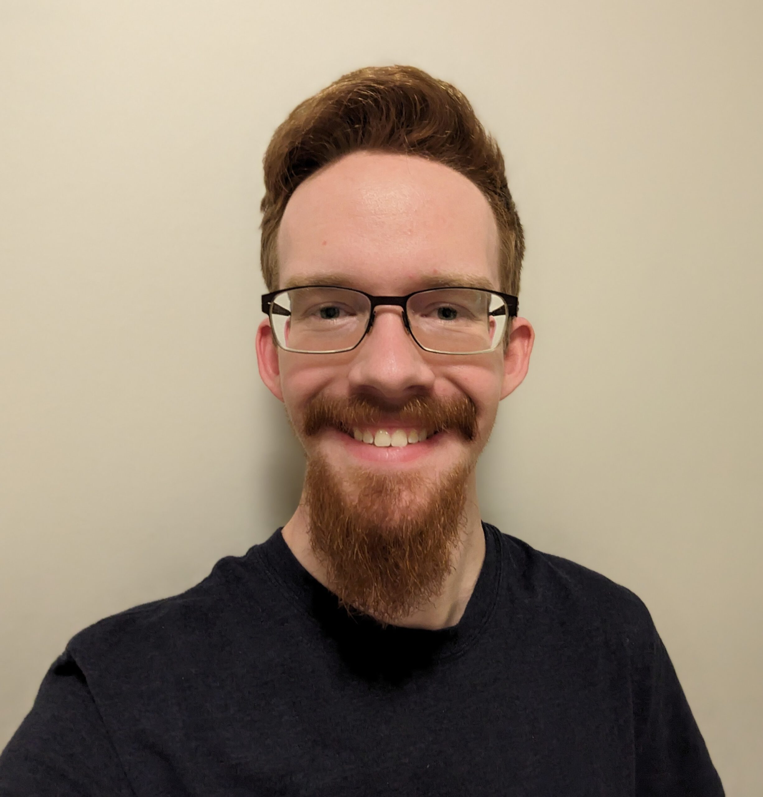 Photo of Carson in black t-shirt with white background